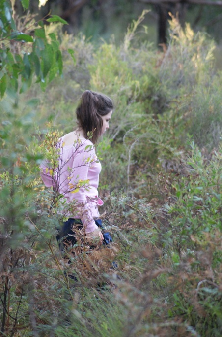 Photo of a girl walking through the Australian bush